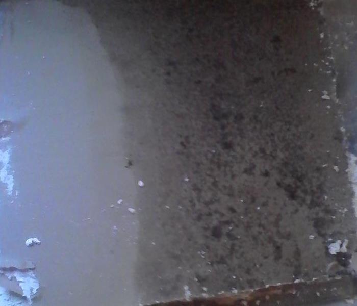 Dark wet stains on a ceiling due to water damage