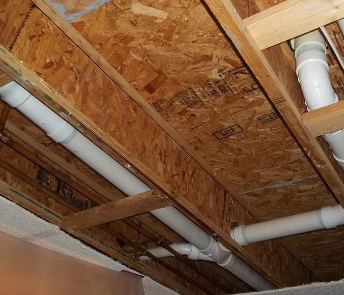 Ceiling removed, wood exposed after water remediation