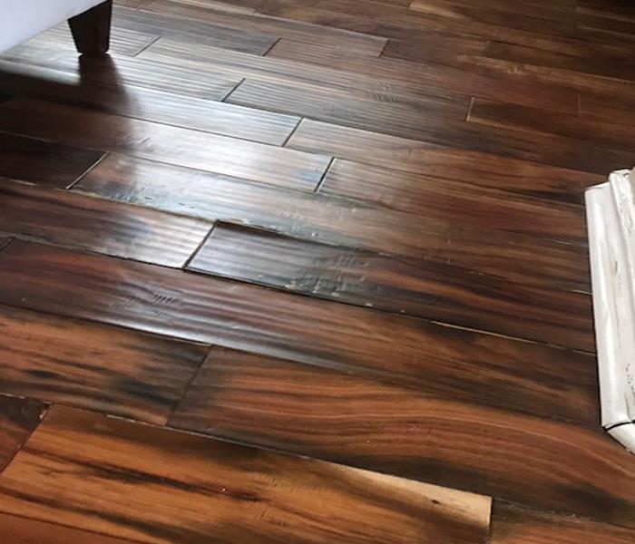 Hardwood Floor with buckling due to water