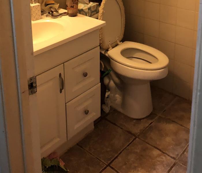 Bathroom with sink and toilet and dirty tile