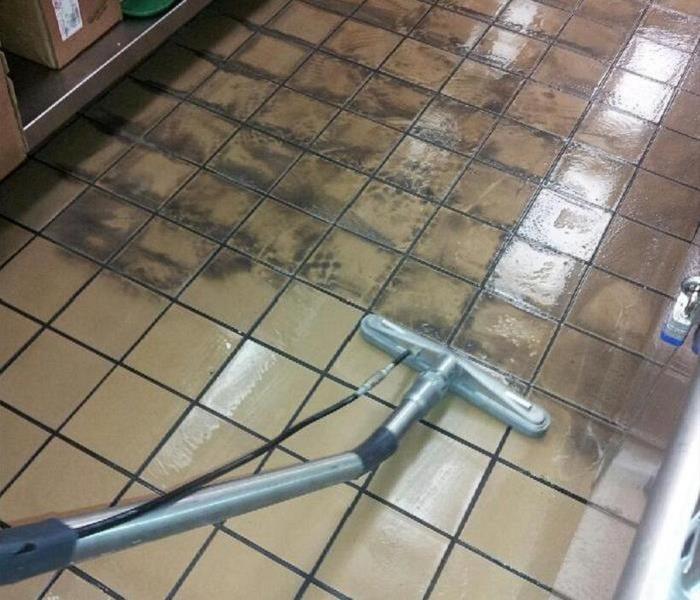 Tile cleaned on one half and dirty on the other side