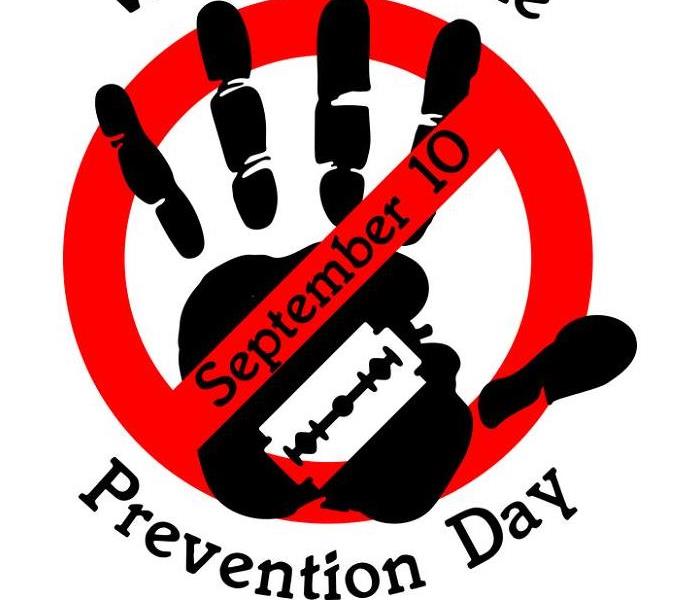 Red no sign through black hand September 10 Prevention Day